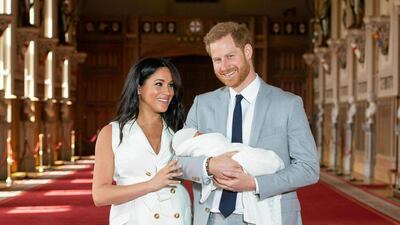 Prince Harry and Meghan pose during a photocall with their newborn son Archie, in St George's Hall at Windsor Castle in May 2019. AP Photo