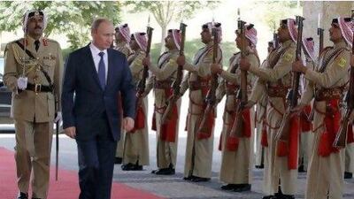 Russian president Vladimir Putin reviews the Jordanian royal honour guard as he arrives for a meeting with Jordan’s King Abdullah II.