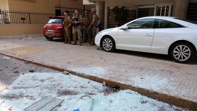 Shattered glass on floor as soldiers are deployed. Reuters