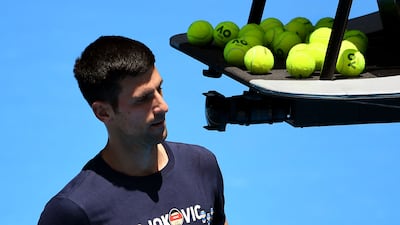 Novak Djokovic of Serbia takes a break during a practice session ahead of the Australian Open at the Melbourne Park tennis centre in Melbourne on January 12, 2022. AFP