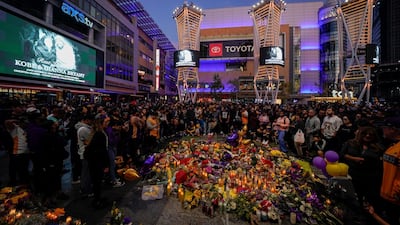 Fans of NBA basketball star Kobe Bryant pay their respects at a memorial outside the Staples Center in Los Angeles, California, on Monday, January 27. Reuters