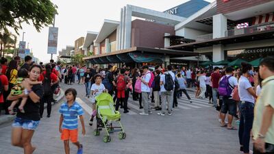 People come out from a commercial mall following the earthquake at Subic Bay Freeport in Zambales province, north of Manila. EPA
