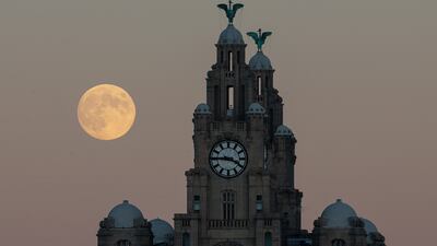 The December full moon rises above the Royal Liver Building in Liverpool, north-west England. EPA