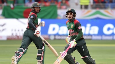 Mushfiqur Rahim, right, scored 144 as Bangladesh set Sri Lanka a total of 261 in their Asia Cup opener at Dubai International Stadium. AFP