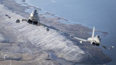Two Typhoons flying over the Falkland Islands in a UK Ministry of Defence photo. PA