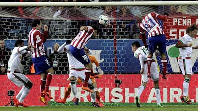 Atletico Madrid striker Diego Costa scores during his side's win over Granada on Wednesday. Kiko Huesca / EPA / March 26, 2014