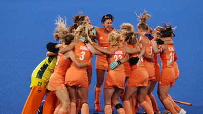 Team Netherlands celebrate victory in the women's hockey gold medal match against Argentina.