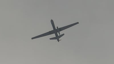 A US drone flies over the airport in Kabul. AFP