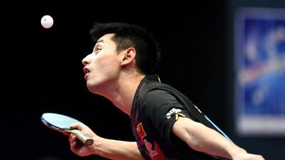 Zhang Jike of China serves the ball during his singles semi-final match against Ma Long of China at the Asian Table Tennis Qualification Tournament for the 2016 Rio Olympics in Hong Kong. Issac Lawrence / AFP Photo