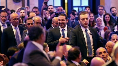 Lebanese prime minister Saad Hariri greets the audience on his arrival at a regional banking conference in Beirut on November 23, 2017. Hussein Malla / AP Photo
