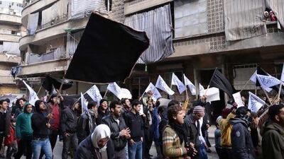 Syrian supporters of the Al Qaeda-linked Jabhat Al Nusra group march during an anti-regime demonstration in the Bustan Al Qasr district of Aleppo.