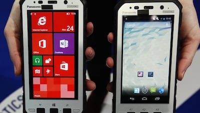 Panasonic’s new Toughpad handsets are displayed at the Japanese company’s stand at the Mobile World Congress in Barcelona. Panasonic said it will make a partial return to the smartphone market with two high-cost models, marketed at business customers as counterparts to its hard-wearing Toughbook laptops and Toughpad tablets. Gustau Nacarino / Reuters