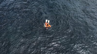 A drone view shows an "Ama" female free diver, who harvests sea life from the ocean, working in the sea in Minamiboso, Chiba Prefecture, Japan.