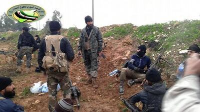 A Dec 14, 2014 photo provided by the Syrian Observatory for Human Rights,showing fighters from the Al Qaeda-linked Al Nusra Front and other rebel factions in Wadi Deif in the northwestern province of Idlib, Syria. The group is in a standoff with moderate rebels in southern Syria after the killing of a rebel commander, Mousab Ali Qarfan, from the Shuhada Al Yarmouk Brigades. Syrian Observatory for Human Rights / AP Photo