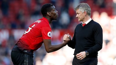 Ole Gunnar Solskjaer, right, is confident that Paul Pogba is going to stay at Manchester United. PA Photo