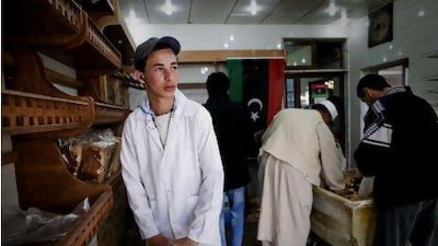Mokhtar Lebeidi works as a volunteer baker in a bread shop in Benghazi to fill the void left in Libya's workforce by fleeing foreign workers.