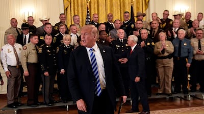 US President Donald Trump fields reporters' questions in the White House. Susan Walsh / AP