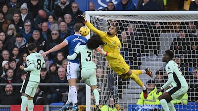 Chelsea goalkeeper Robert Sanchez and teammate Marc Cucurella jump for the ball with James Tarkowski of Everton. Getty Images