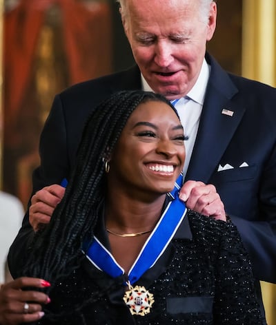 Simone Biles receives the US Medal of Freedom from President Joe Biden in July 2022. Photo Simone Biles / Instagram