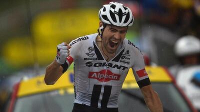 Netherlands’ Tom Dumoulin celebrates as he crosses the finish line of the 184.5km ninth stage of the 103rd Tour de France cycling race on July 10, 2016 between Vielha Val d’Aran and Andorre Arcalis. Lionel Bonaventure / AFP
