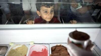Five-year-old Khalid Abdulrahim waits patiently for his free ice cream during the Health & Fitness Fun Day at the Abu Dhabi National Exhibition Center in Abu Dhabi. The two-day event offers free health screenings and counseling, fitness activities as well as different snacks. Silvia Razgova / The National