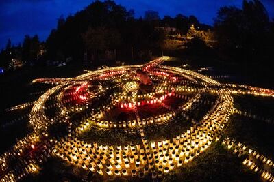 Gertrud Schop lights candles dedicated to Covid-19 victims in Germany. She plans to continue the project until a vaccine is available. AFP