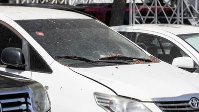 Abandoned cars on Baniyas road near the cordoned entrance to the quarantined area