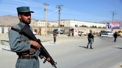 Afghan Police stand guard at a checkpoint ahead of parliamentary elections, in Kabul, Afghanistan. AP