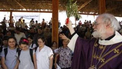 Archbishop of Canterbury Rowan Williams presides over a service at the Baptism site at the River Jordan, in Wadi Kharrar, Jordan on February 20, 2010.