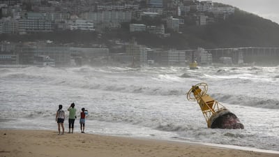 A buoy un-tethered during heavy swell brought by Typhoon Maysak on Haeundae beach in Busan. AFP