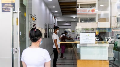 A money exchange house in Satwa, Dubai as residents send remittances home to help families tide over the challenges triggered by the coronavirus outbreak. Reem Mohammed / The National
