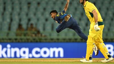 Sri Lanka's Dilshan Madushanka bowls as Australia's Mitchell Marsh backs up. AFP