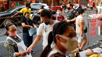 Vendors sell food in Chinatown in Bangkok. Reuters