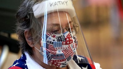 Harris County election clerk Kathy Kellen wears a mask and face shield while working at a polling site in Houston, Texas this week. AP Photo
