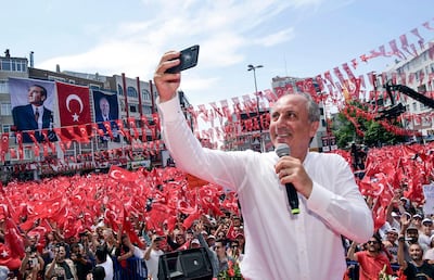 Muharrem Ince, presidential candidate of Turkey's main opposition Republican People's Party, takes a selfie at the end of his address at an election rally in Corlu, Turkey, on June 20, 2018. (CHP Press Service/Pool Photo via AP)