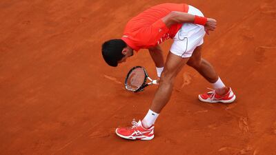 Djokovic smashes his racket in frustration. Getty Images