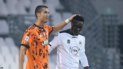 Juventus' Cristiano Ronaldo with Spezia's Emmanuel Gyasi after the match. Reuters