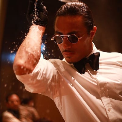 Salt Bae doing his signature salt-sprinkling move at Nusr-Et Steakhouse London. Photo: Instagram