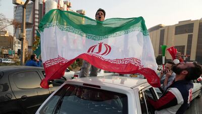 People celebrate after Iran's World Cup win over Wales. The political turmoil that followed the death of Mahsa Amini in police custody has cast a shadow over Iran's matches at the World Cup and global energy supplies.AP