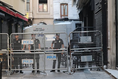 Turkish police guard a barricade outside the offices of LeMan magazine in Istanbul on Tuesday. EPA