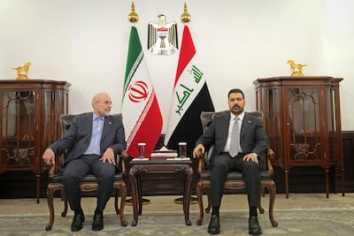 Iraqi Prime Minister Ali Al Zaidi, right, with Iranian parliament speaker Mohammed Bagher Ghalibaf in Baghdad. Iraq is under pressure to disarm Iran-linked militias on its territory. AFP