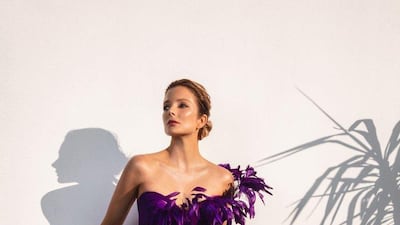 A purple asymmetric dress with feathers. Courtesy Jean-Louis Sabaji
