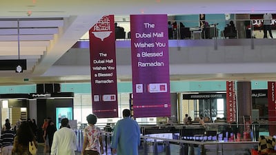 People shopping during Ramadan. Our writer asks: is the current Ramadan break too short? Satish Kumar / The National