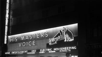 Record label logo for Victrola RCA Victor, showing the dog Nipper looking into the horn of a Victrola, outside the HMV shop, Oxford Street, London in April 1949. Keystone Features / Getty Images