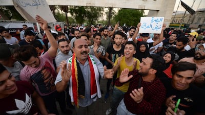 Iraqi protesters chant slogans during a demonstration to support the protesters in Basra city, at Tahrir Square in central Baghdad. EPA