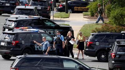 Police officers secure the crime scene. Joshua Roberts / Reuters