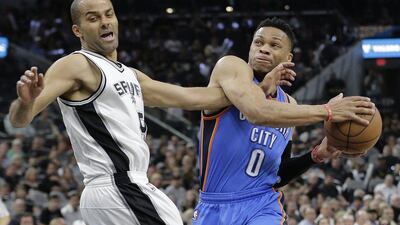 Oklahoma City Thunder guard Russell Westbrook (0) drives to the basket against San Antonio Spurs guard Tony Parker during the first half in Game 5 of a second-round NBA basketball playoff series, Tuesday, May 10, 2016, in San Antonio. (AP Photo/Eric Gay)