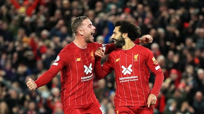 Mohamed Salah celebrates with Jordan Henderson after scoring Liverpool's second goal against Tottenham at Anfield. PA