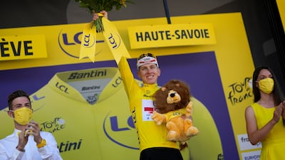 Race leader Tadej Pogacar on the podium after Stage 10. AP