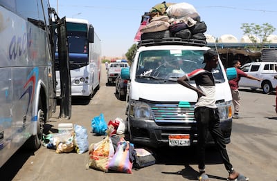 People fleeing Sudan arrive at Wadi Karkar bus station in Aswan, southern Egypt in May 2023. EPA